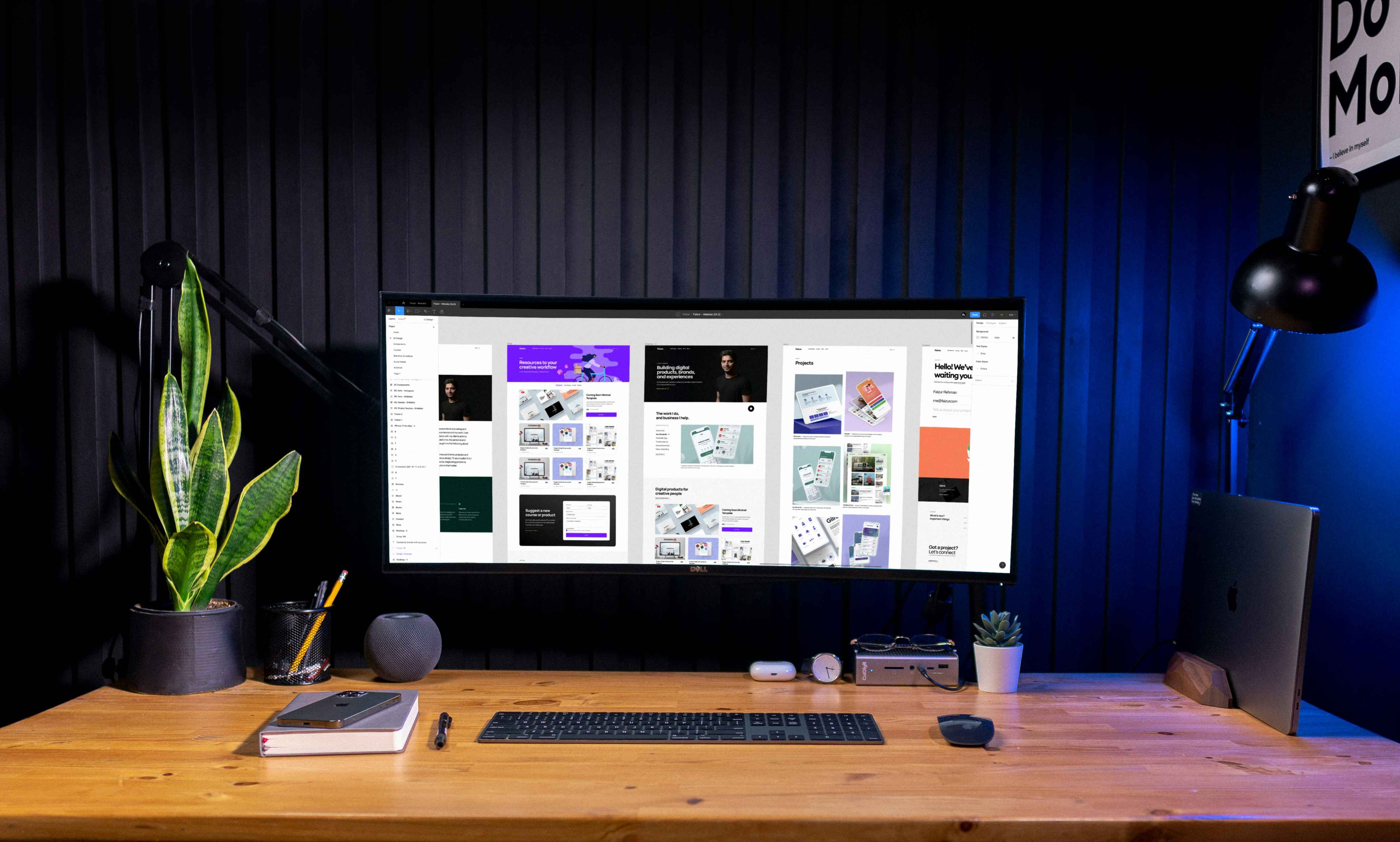 Desk with monitor showing web design